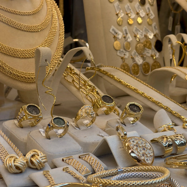 Close up of 18k jewelry on window