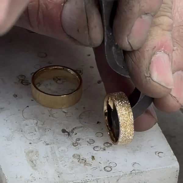 Artisan during the process of hallmarking each piece