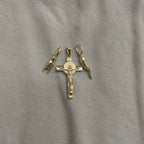 18k Italian Gold Crucifix Pendant laying along with Italian Horn and Hand.