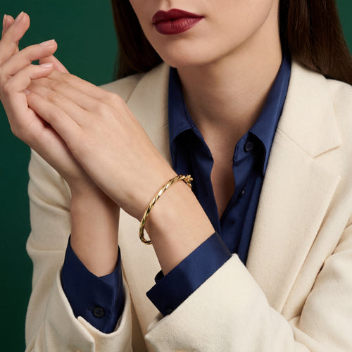 Model_wearing_twisted_rigid_bracelet