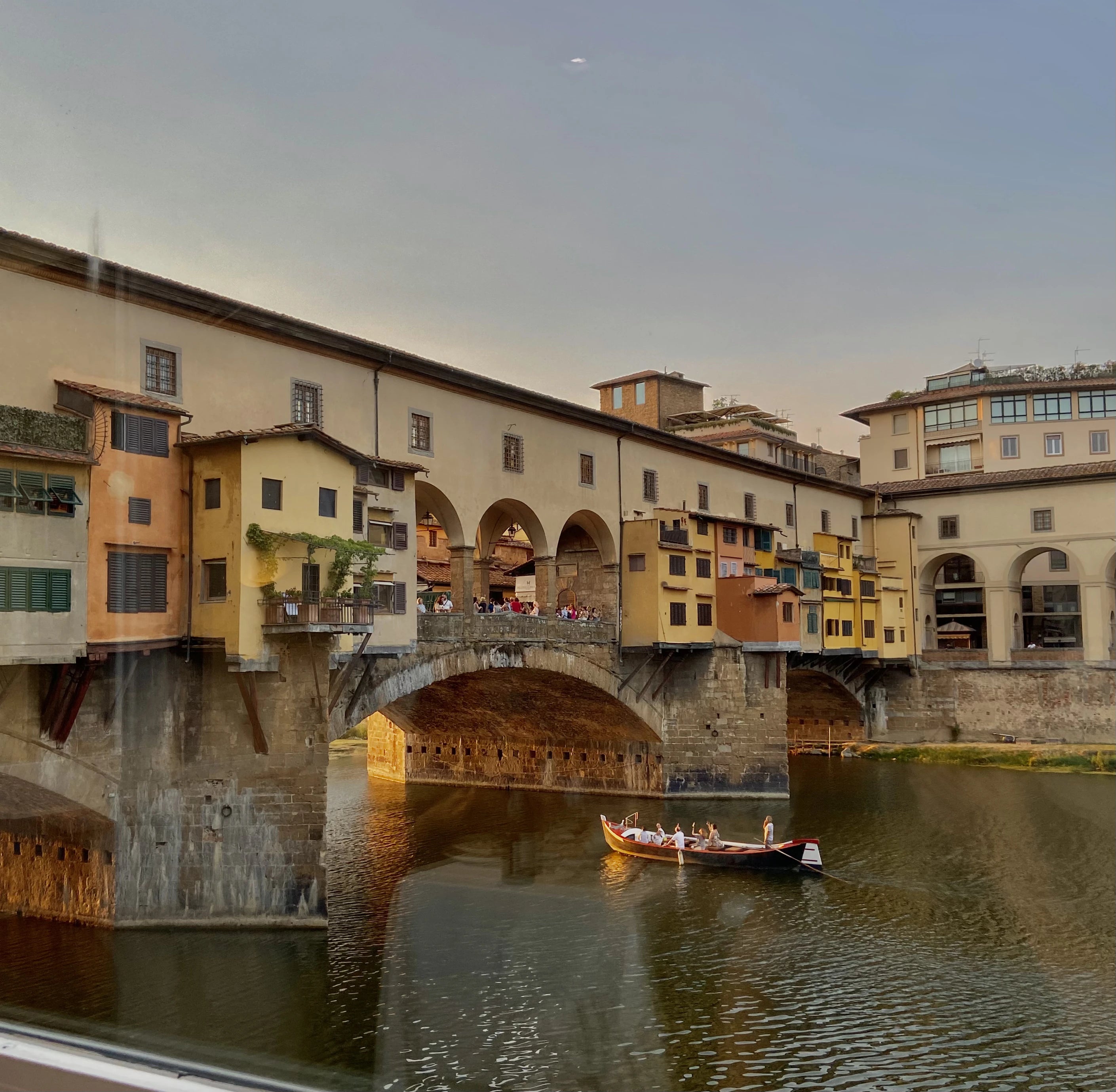 Ponte Vecchio Florence represented during Golden Hour, 3 arches visible
